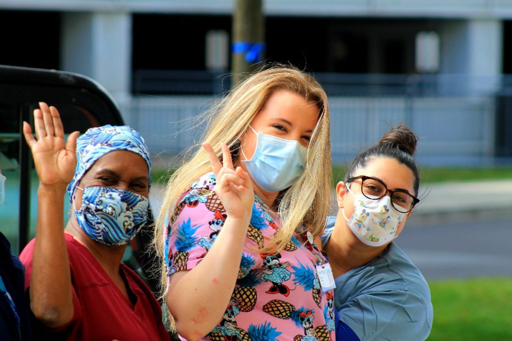 People With Mask In The Street Saying Hello